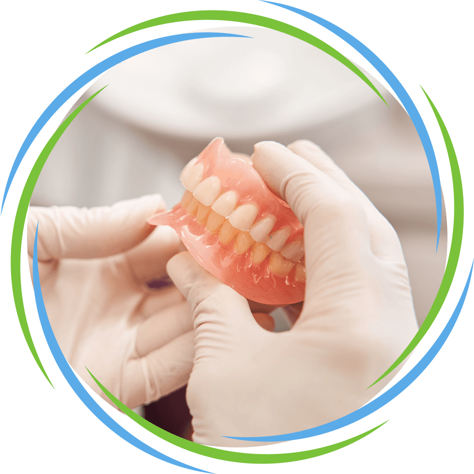 dentist holding dentures